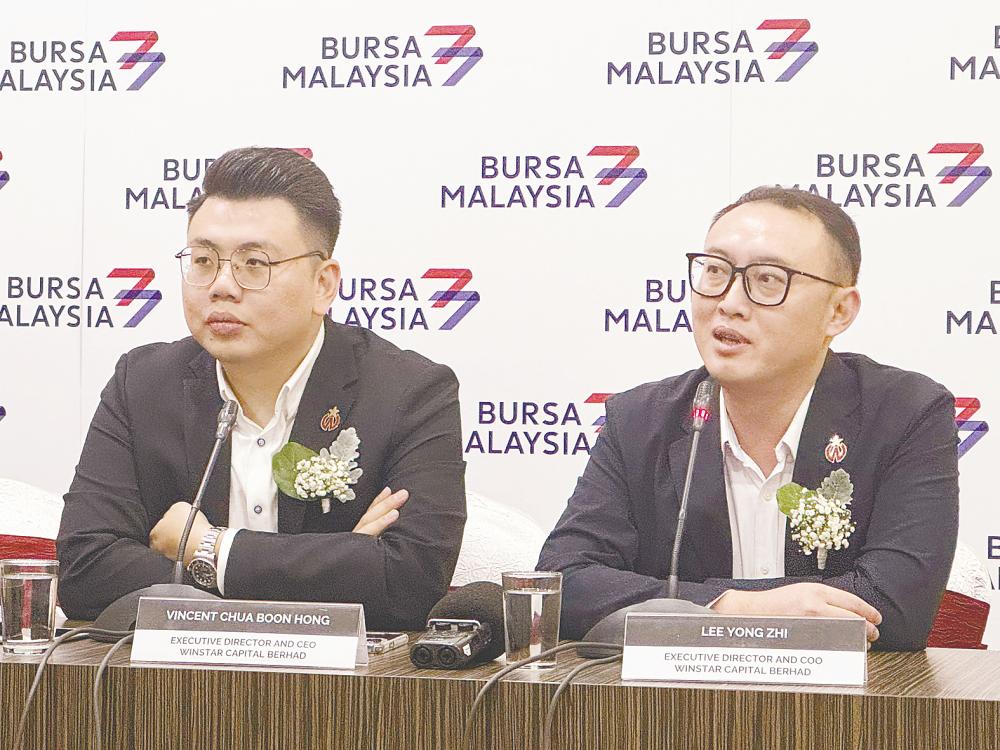 Chua (left) and executive director and COO Lee Yong Zhi at the press conference.