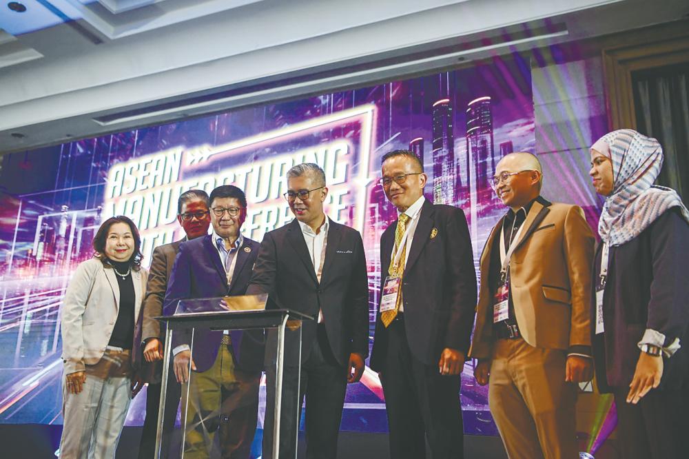 Tengku Zafrul (centre) launching AMYC 2024, as Soh (third from left) and other dignitaries look on. – Bernamapic