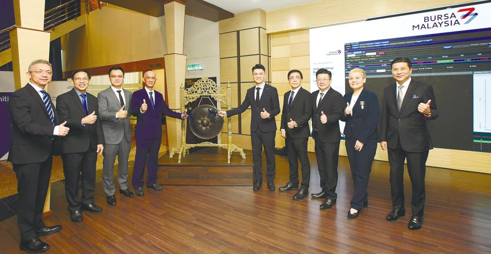 From left: M&amp;A Securities corporate finance head Gary Ting, Zantat directors Poo Lap Tuck and Chan Jee Chet, co-founder and deputy chairman Chan Hup Ooi, Chan, chairman Yap Yoon Kong, directors Gan Seng Kian and Rima Ramona Muhammad Arif and M&amp;A Equity managing director Datuk Bill Tan at the listing ceremony.