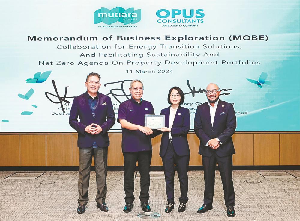 Boustead Properties CEO Khairul Azizi Ismail (second from left) and Opus International managing director Hillary Chua (second from right) at the signing ceremony together with Izaddeen (left) and Syahrunizam.