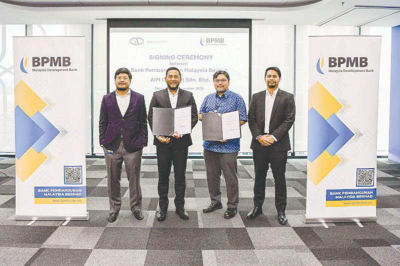 From left: Roni, Abd Rahim, BPMB managing director Mohamed Nazri Omar and ACSB business development manager Iqmal Ridzuan Abd Rahim at the signing ceremony.