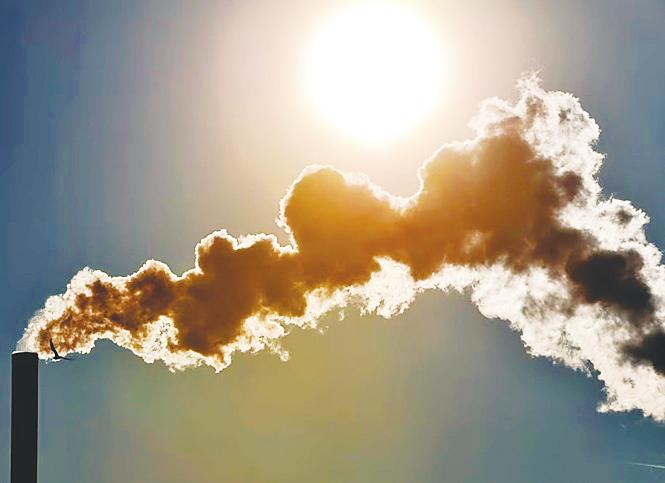 View of smoke billowing from a chimney. Economists caution that Malaysia’s plan to roll out a carbon tax in 2026 may face challenges, particularly in balancing environmental goals with industrial competitiveness. – AFP filepic