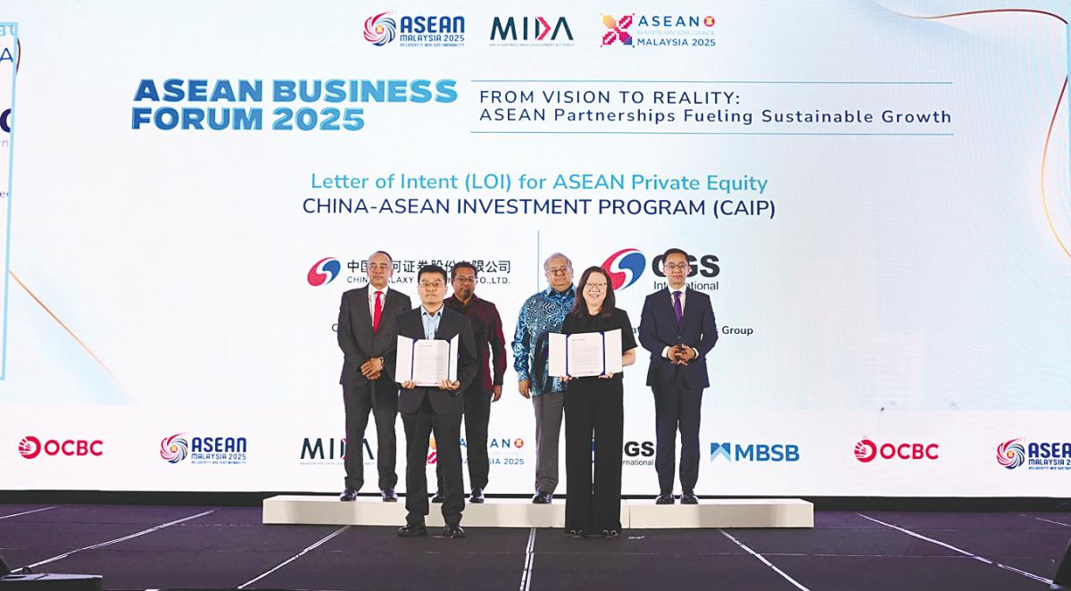 From left: Nazir, CGS strategic development headquarters member of executive committee, business director and general manager Zhang Ruibin; Sikh Shamsul Ibrahim, Mohammad Faiz, Fong and Wang with the signed LoI for the China-Asean Investment Programme.