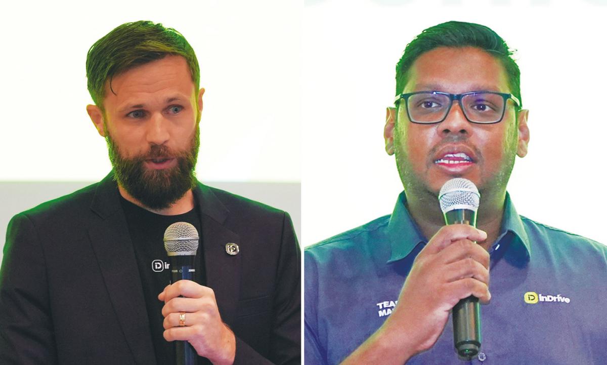 Tolley (left) and Govin speaking at the press conference.