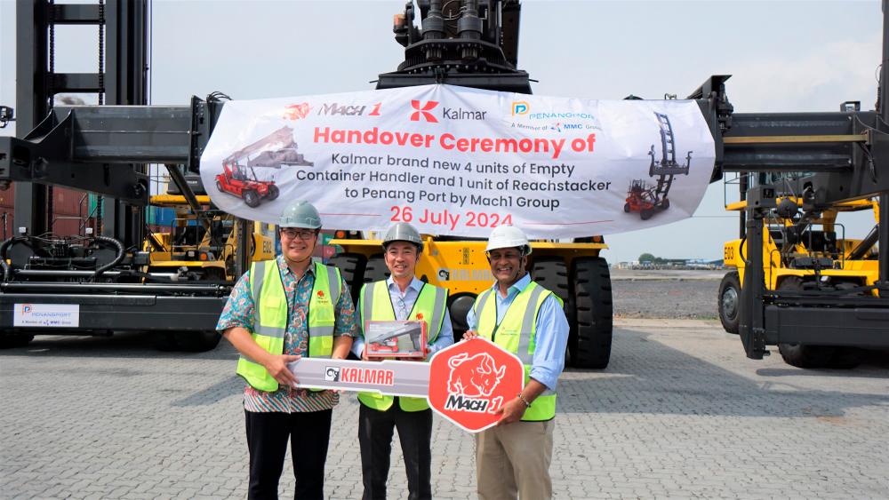 From left: Pan, Teo and Sasedharan at the handover of Kalmar container handlers to Penang Port.