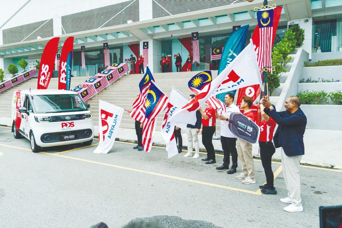 A ceremony was held to mark the handover of the new EV vans to Pos Malaysia.