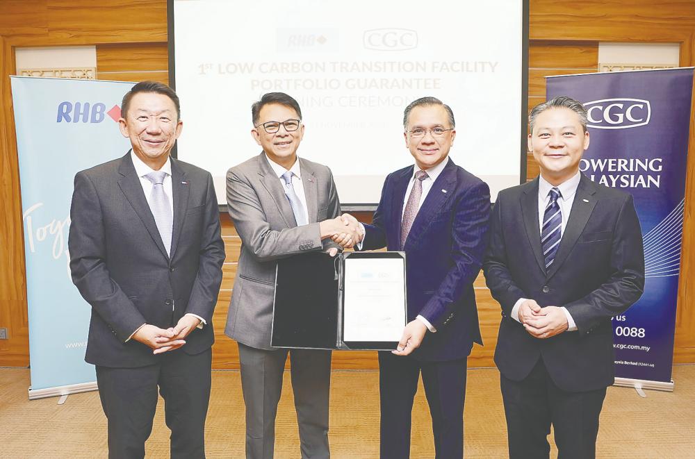 From left: RHB Banking Group community banking managing director Jeffrey Ng Eow Oo, Mohd Rashid, Mohd Zamree and CGC chief business officer Sean Tan at the signing ceremony.