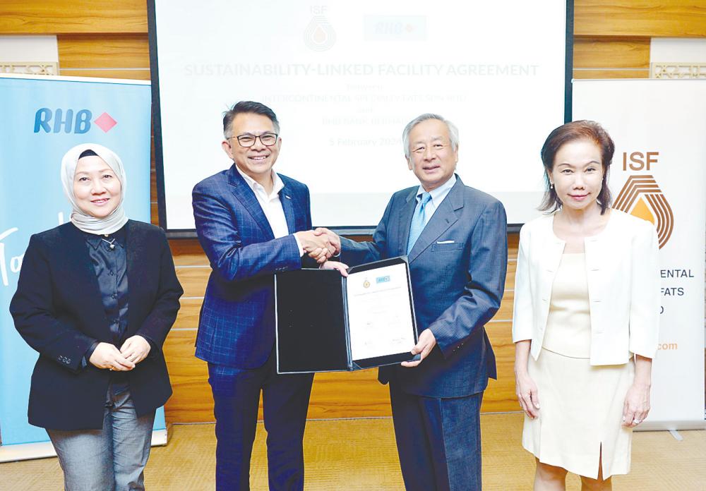 Mohd Rashid (second from left) and Ishigami at the SLF signing. They are flanked by RHB Group chief sustainability and communications officer Norazzah Sulaiman (left) and ISF chief marketing officer Khoo Yoke Lian.