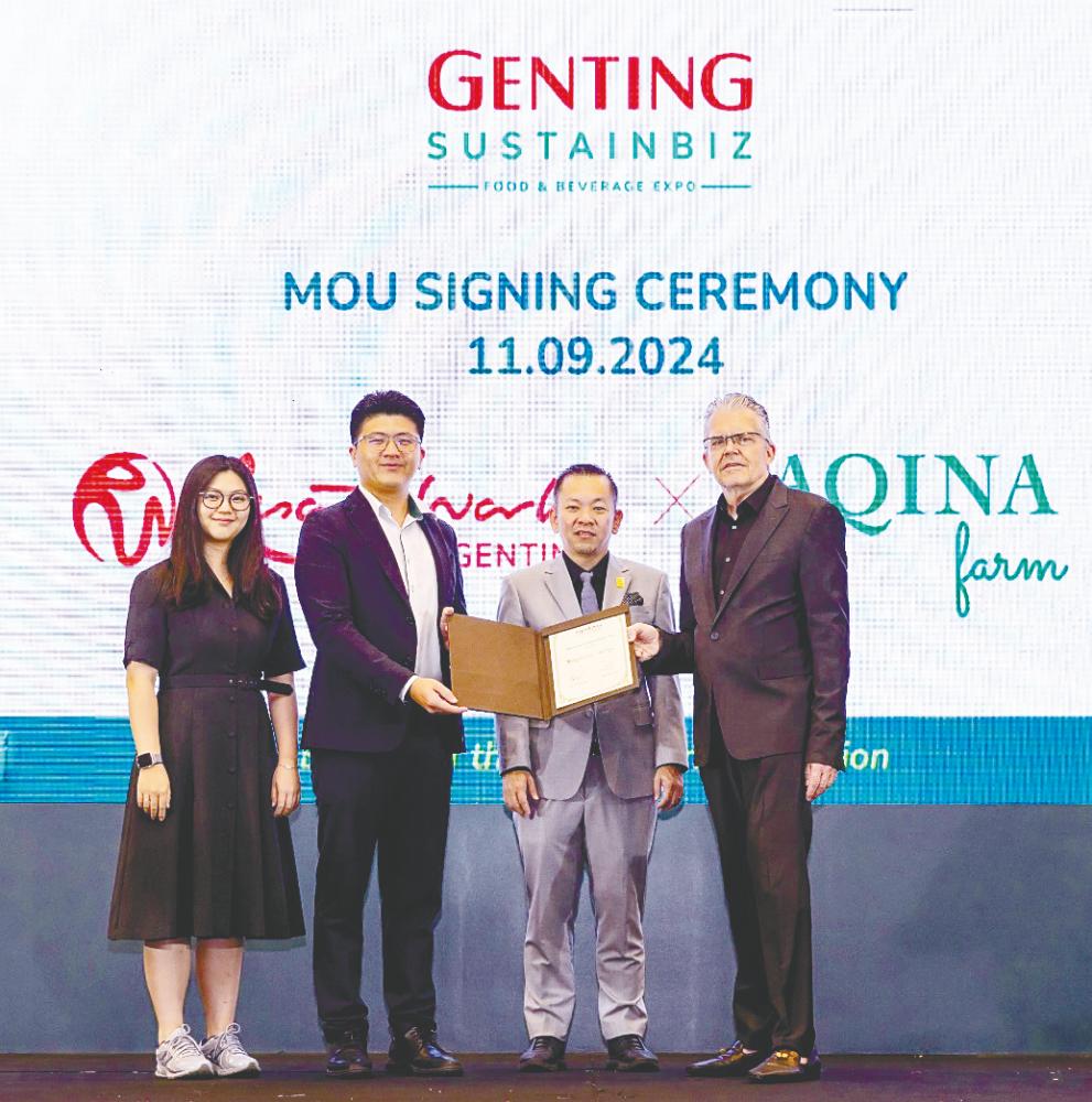 Chan (third from left), Tan (second from left) and RWG executive vice-president of leisure, hospitality and lifestyle Peter Foster at the signing ceremony.