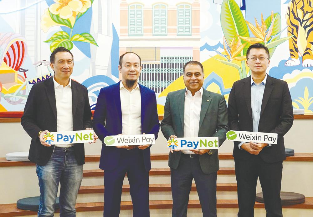 From left: PayNet chief marketing officer Gary Yeoh, Yang, Farhan and Weixin Pay assistant regional director/Southeast Asia David Chong.