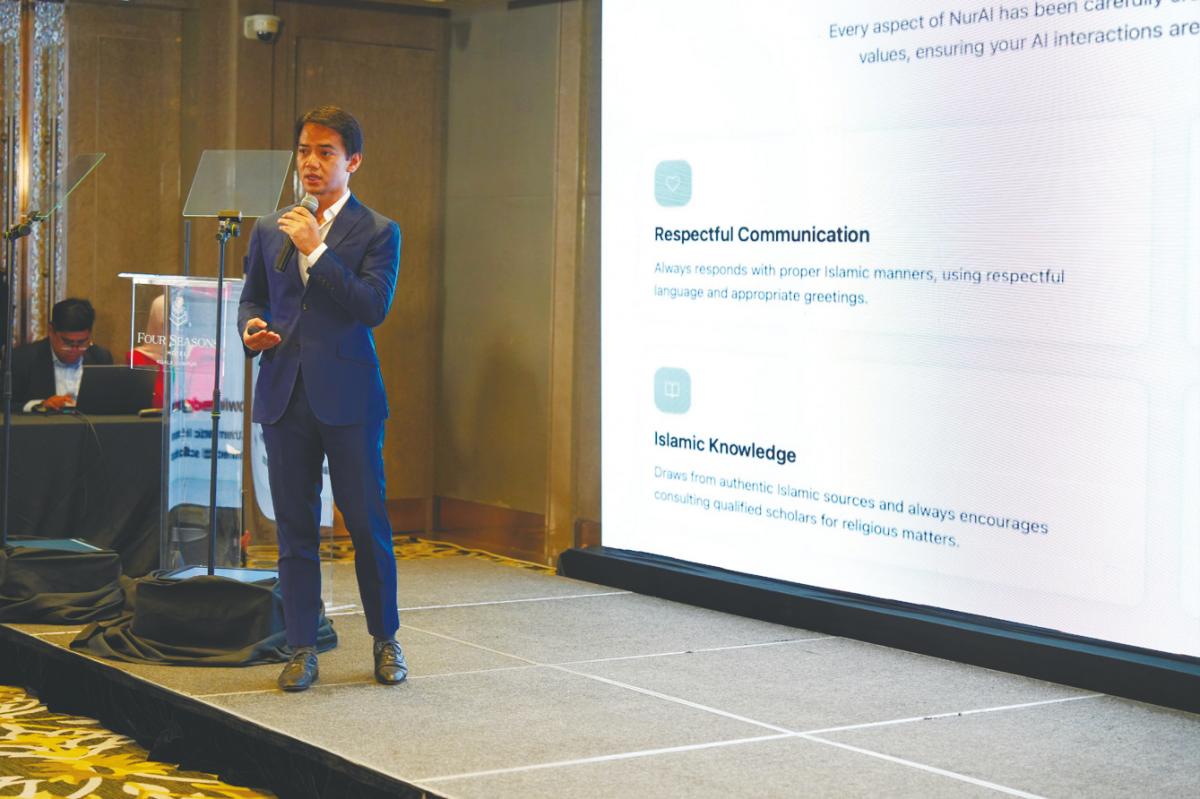 Fadzli speaking at the launch of NurAI/