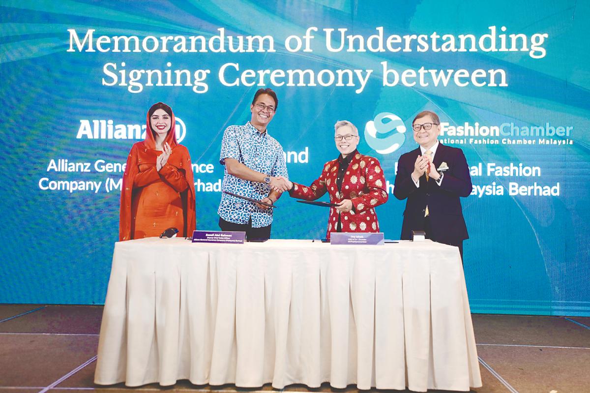 From left: Leena, Allianz General deputy chief sales officer Sazali Abd Rahman, Jay, and Malaysia External Trade Development Corporation deputy CEO Abu Bakar Yusof at the MoU signing ceremony.