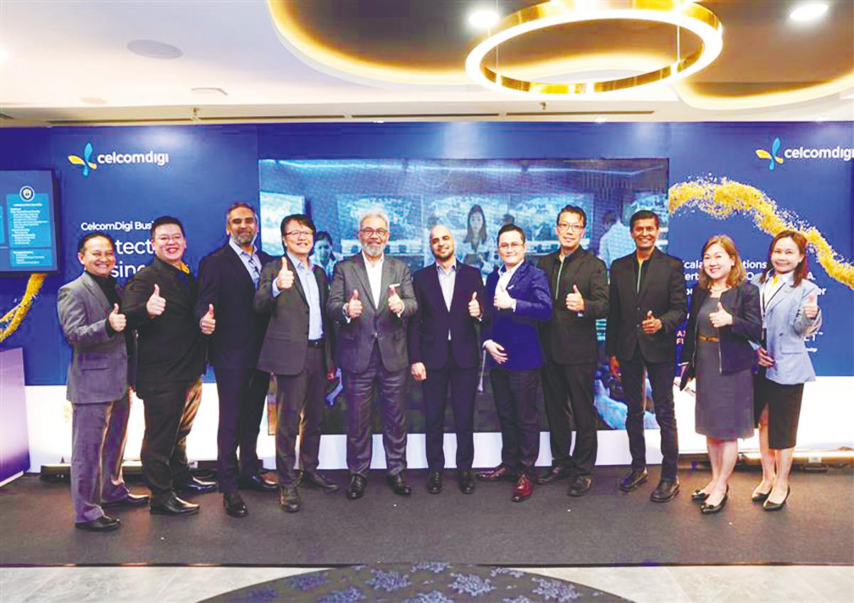 Afizulazha (fifth, left) at the launch of CelcomDigi’s AI-driven cybersecurity solutions.