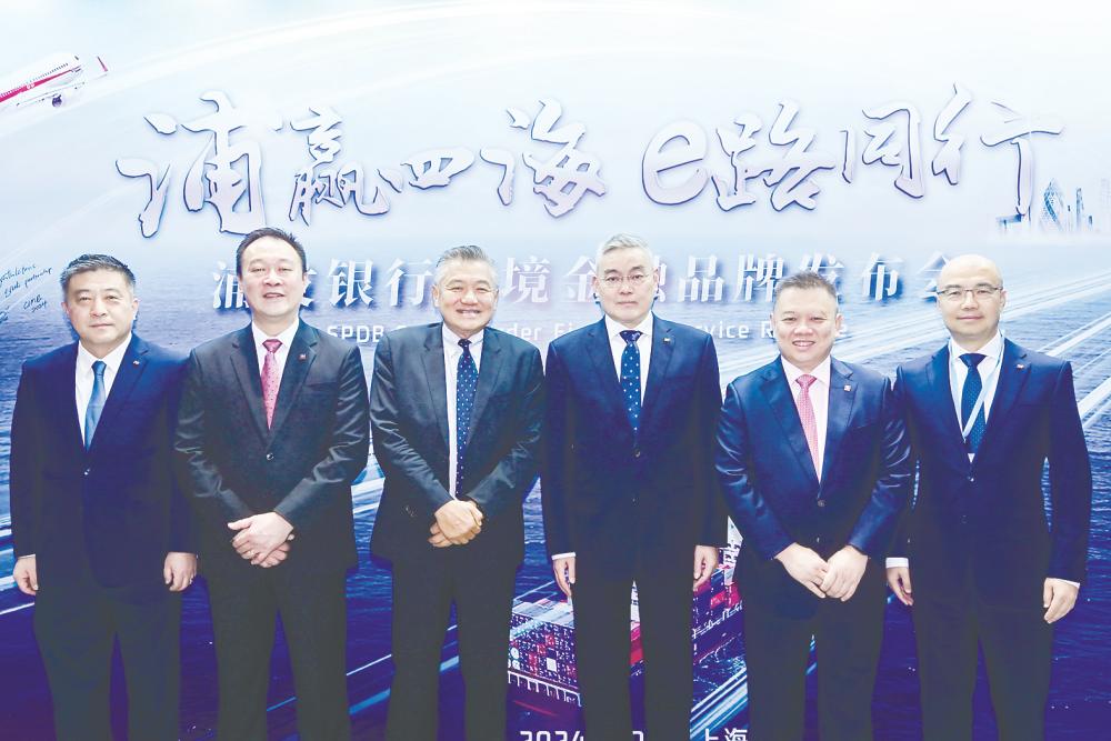 From left: SPDB Singapore president Ren Jun, CIMB Group wholesale banking financial institution Malaysia head and managing director Beh Sui Chung, CIMB Group wholesale banking adviser Thomas Tan; SPDB president Xie Wei; Chu and SPDB cross-border finance (offshore banking centre) deputy general manager Li Ge.