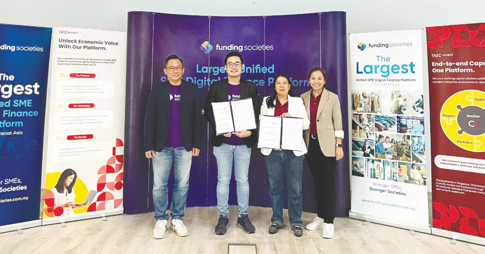 From left: Funding Societies sales and key account head Sean Hor, Chai, Ang and TASConnect (Malaysia) chief business officer Chan Tse Ning at the signing ceremony.