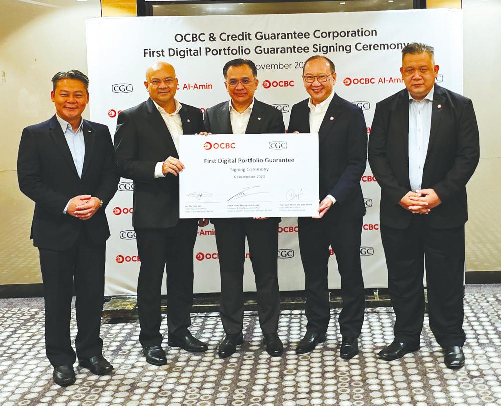 From left: CGC chief business officer Sean Tan, OCBC Al-Amin Bank CEO Syed Abdull Aziz Syed Kechik, Mohd Zamree, Tan and OCBC Bank (Malaysia) emerging business head Chan Kok Leong.