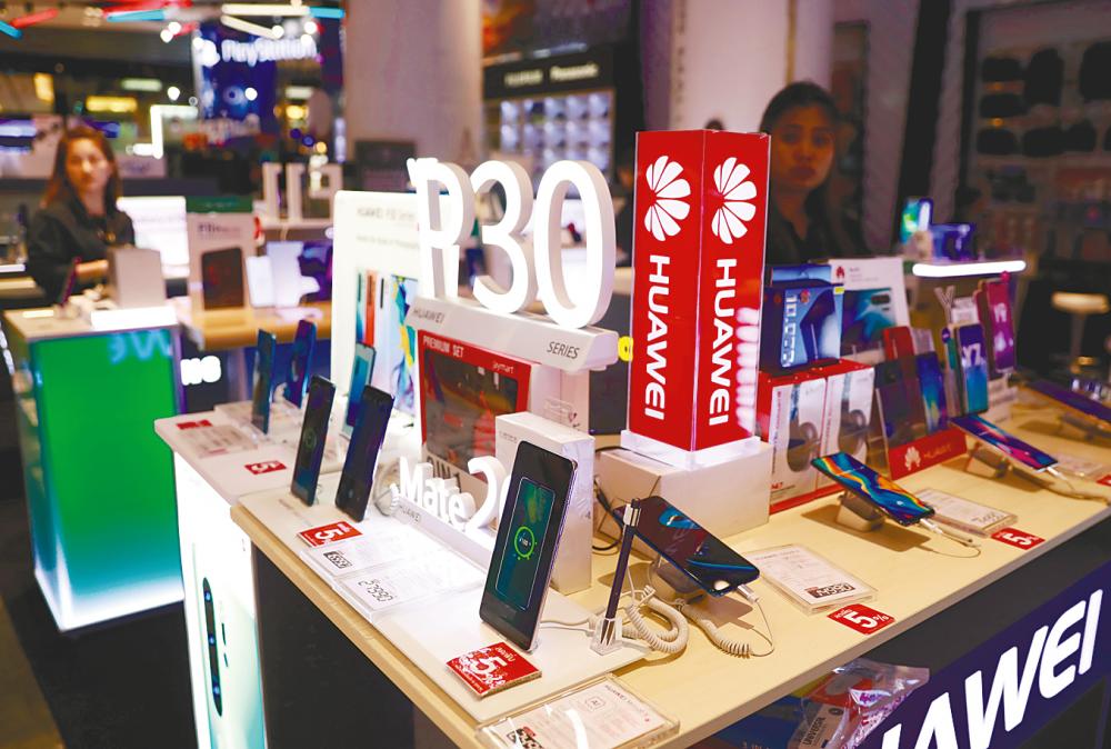 Huawei P30 handsets on sale in a shopping centre in Bangkok, Thailand. Some customers in Singapore and the Philippines have rushed to sell their Huawei phones. – REUTERSPIX