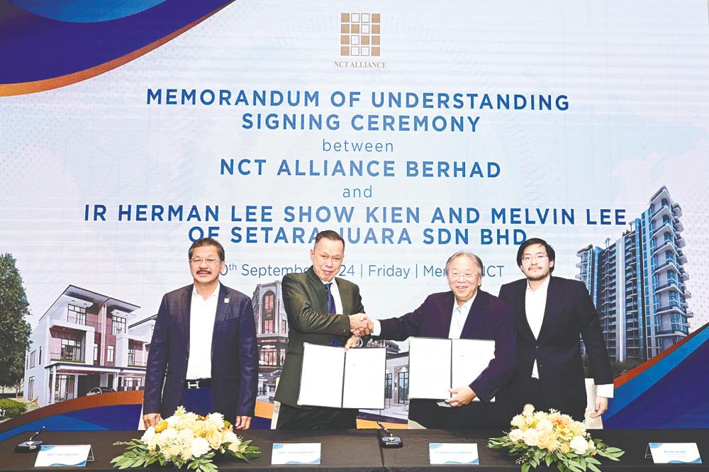 From left: NCT Alliance executive director Datuk Yap Fook Choy, Yap Ngan Choy, Herman and Melvin at the MoU signing ceremony.