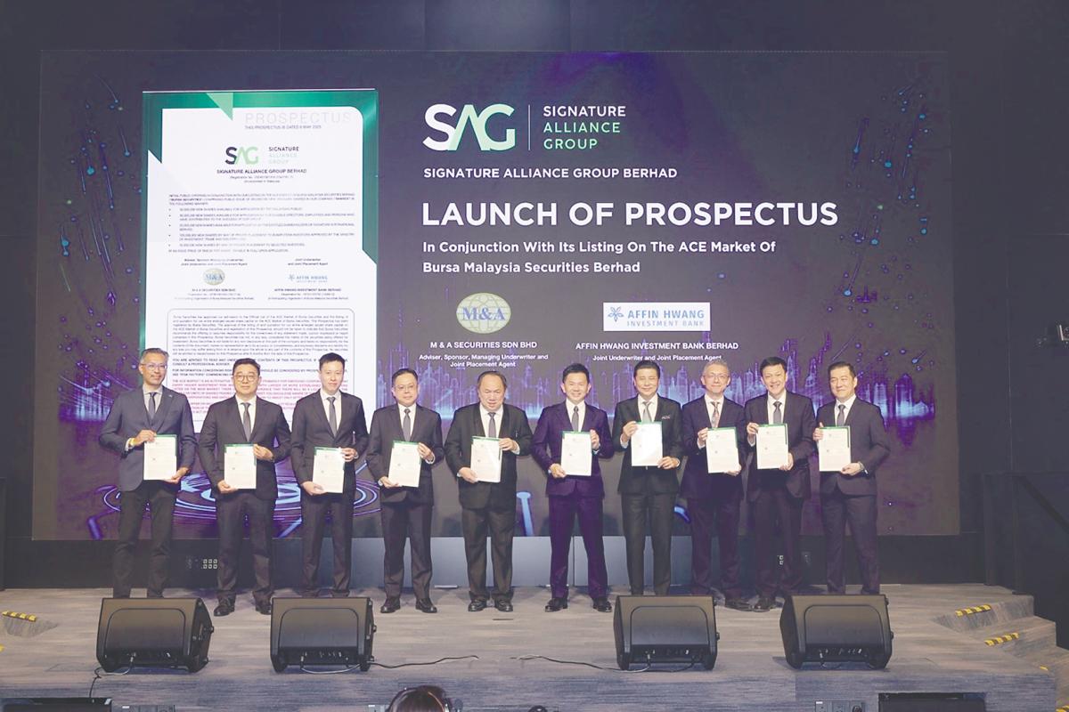 From left: Affin Hwang Investment Bank Bhd head of equity capital markets Arvin Chia, Signature Alliance Group Bhd promoter Melvin Ng, executive director Mario Foo, Chang, promoters Datuk Seri Chiau Beng Teik and Chiau Haw Choon, M&amp;A Equity Holdings Bhd managing director Datuk Bill Tan, M&amp;A Securities Sdn Bhd head of corporate finance Gary Ting, Chin Hin Group Bhd chief financial officer Michael Lim, and Signature International Bhd group CEO Lau Kock Sang at the prospectus launch.