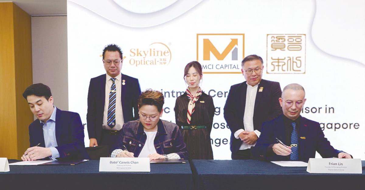 From left: Evolve Capital Pte Ltd partner Andy Chi, Chan and Lin at a signing ceremony in Kuala Lumpur.