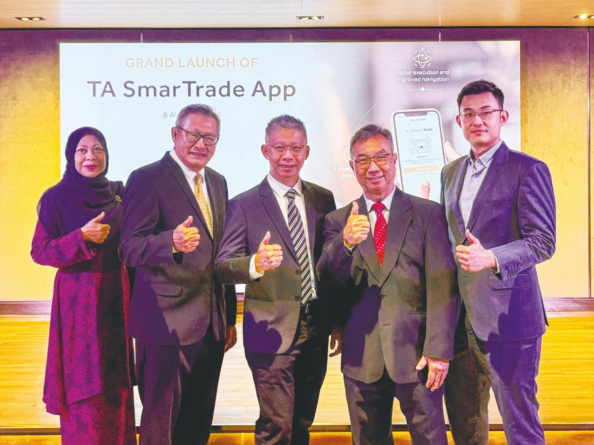 From left: TA Securities Holdings non-independent non-executive director Nor Asma Mohamed, executive director of dealing Datuk Hamzah Mohd Tahir; independent non-executive director Bobby Chew; executive director of operations Tah Heong Beng; and Leong at the official launch of TA SmarTrade.