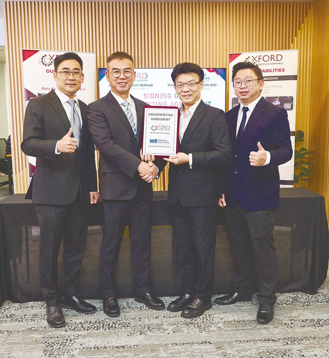 From left : OXB executive director Oh Yen San, Ng, Malacca Securities corporate finance committee chairman Tan Kok Tiam and corporate finance co-head Law Kim Fatt.