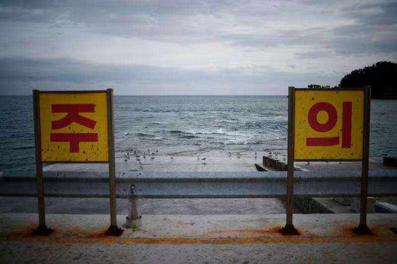 A view shows caution signs on Yeonpyeong Island, South Korea - REUTERSpix