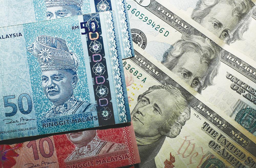 Bank Negara says that Malaysia adopts a floating exchange rate regime and the ringgit’s exchange rate is market-determined. – REUTERSPIX