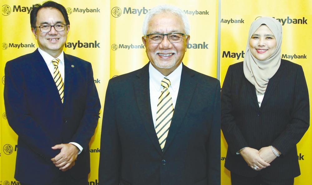 From left: Farid, Maybank chairman Tan Sri Zamzamzairani Mohd Isa and Khalijah at the FY21 results briefing yesterday.