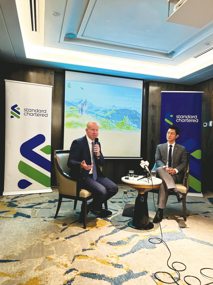 Brice (left) and Standard Chartered Malaysia head of Managed Investments and Advisory Ng Shin Seong at the briefing.