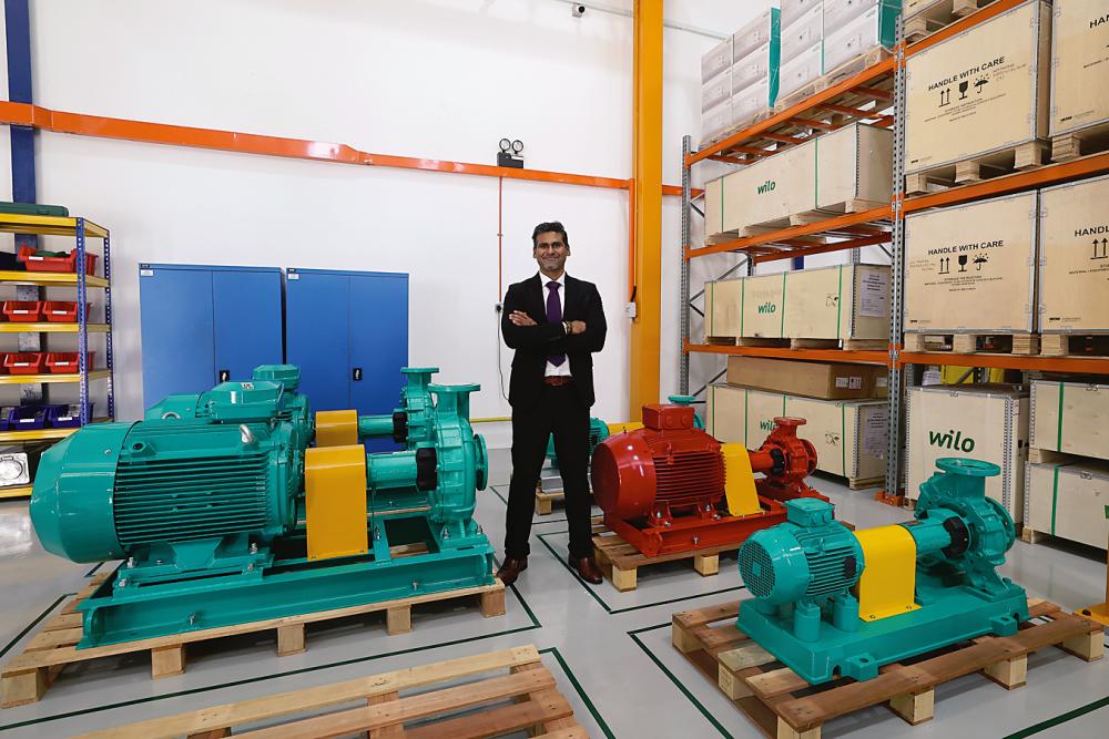 Vignesh with some of Wilo’s water pumps at its assembly plant in Malaysia. – Bernama