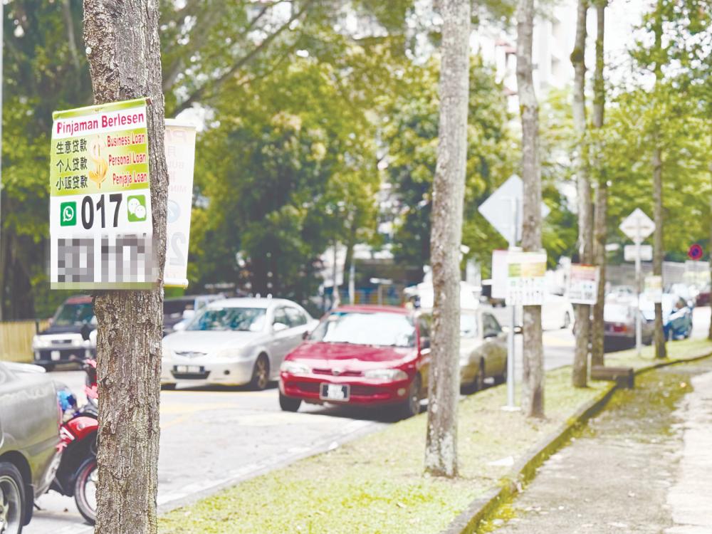 Apart from putting up ‘quick cash’ posters in public places, Illegal moneylenders also use social media to advertise their services, leveraging its wide reach, anonymity and leniency. – ADAM AMIR HAMZAH/THESUN