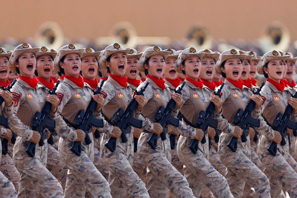 Chinese militia members march during a military parade to mark the 80th anniversary of the end of World War Two, in Beijing, China yesterday. – Reuterspic