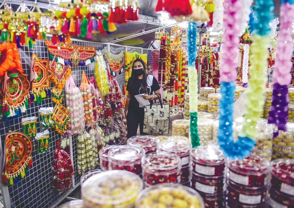 Although there is no lack of visitors browsing the wares on display, traders are saying shoppers are showing a level of prudence never seen before. – Adib Rawi Yahya/theSun