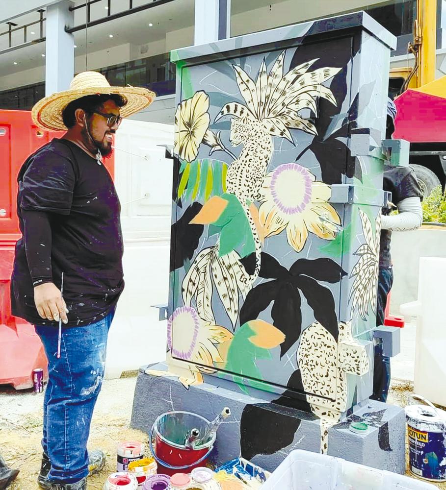 Syamsul Haffiz with one of his artwork. – PIC COURTESY OF SYAMSUL HAFFIZ