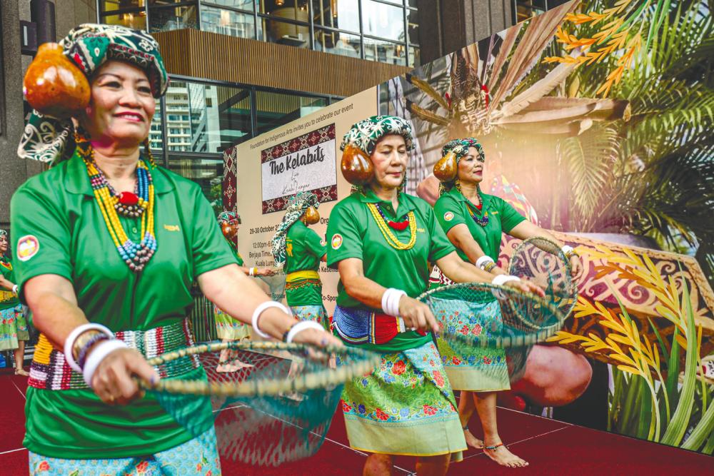 Kelabit performers doing a traditional dance at the event. – AMIRUL SYAFIQ/THESUN