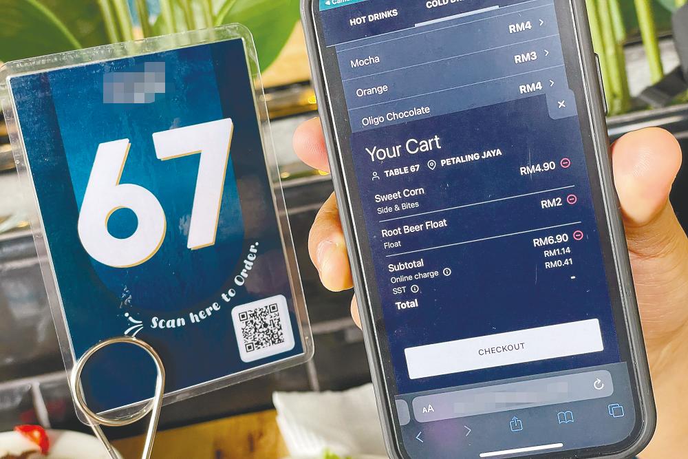 Nadzim said if the restaurant is using the QR code system for its convenience, it should bear the cost itself and not pass the expense to customers. – ADIB RAWI YAHYA/THESUN