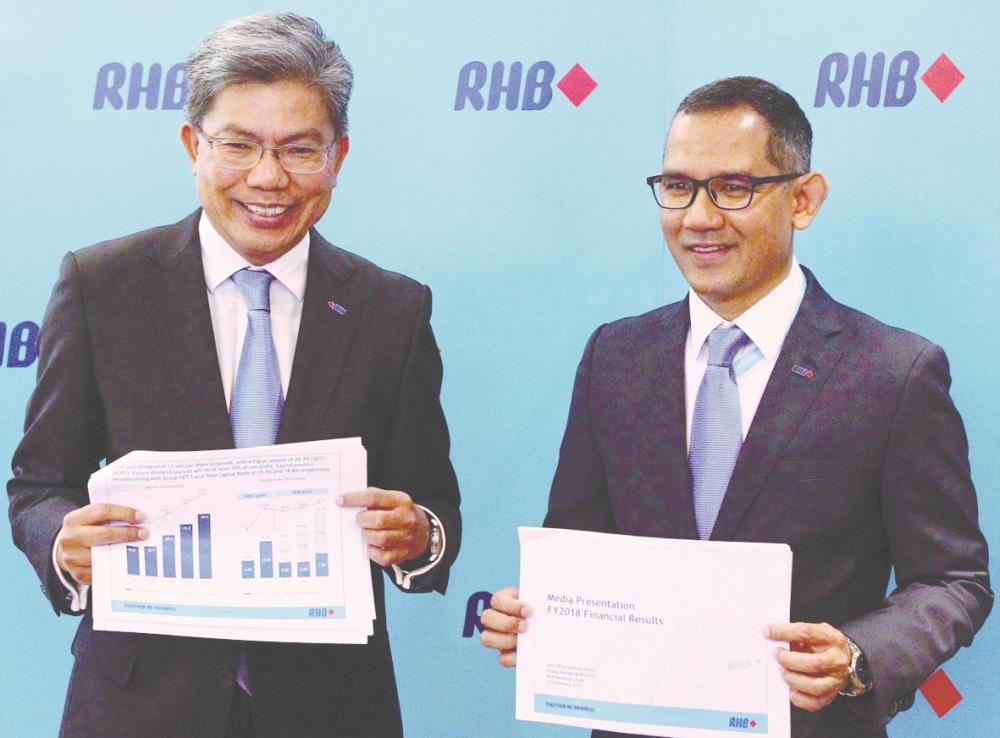 Khairussaleh (left) and group CFO Syed Ahmad Taufik Albar at RHB Bank’s results briefing today. - ZULKIFLI ERSAL/THESUN