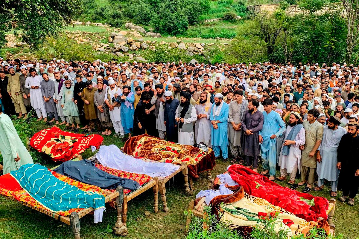 Mourners and locals offer funeral prayers for victims who died in incidents related to flash floods and monsoon rains in Salarzai Tehsil of Pakistan’s Bajaur district on August 15, 2025. Heavy monsoon rains triggered landslides and flash floods across northern Pakistan, killing at least 50 people in the last 24 hours, disaster authorities said August 15. Photo by AFP