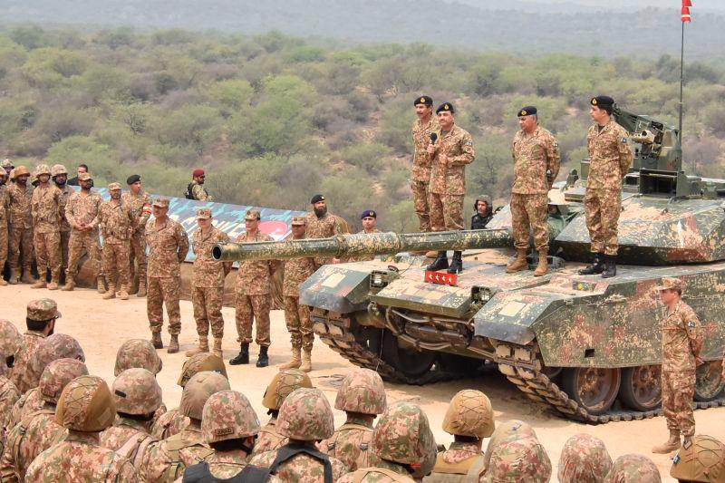 This handout photograph taken on May 1, 2025 and released by the Pakistan’s Inter Service Public Relation (ISPR) shows Pakistan’s Army Chief General Syed Asim Munir (Top 3R) standS on military tank speaks with army troops to witness exercise ‘Hammer Strike’ a high-intensity field training exercise conducted by Pakistan Army’s Mangla Strike Corps at the Tilla Field Firing Ranges (TFFR) in Jhelum, Punjab province. AFPpix