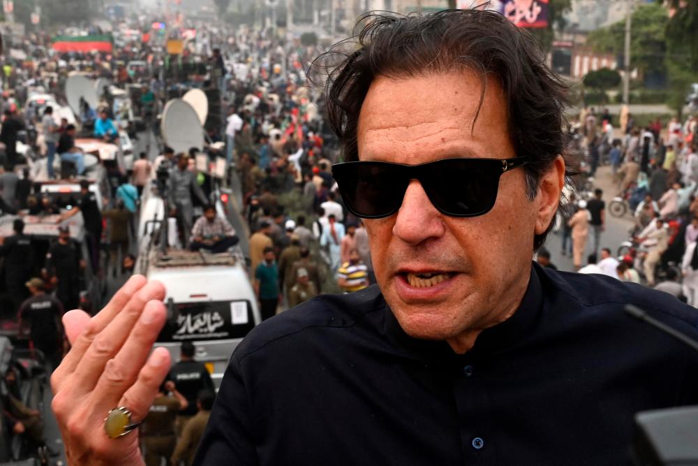 In this photograph taken on November 1, 2022, Pakistan's former prime minister Imran Khan speaks while taking part in an anti-government march in Gujranwala. AFPPPIX