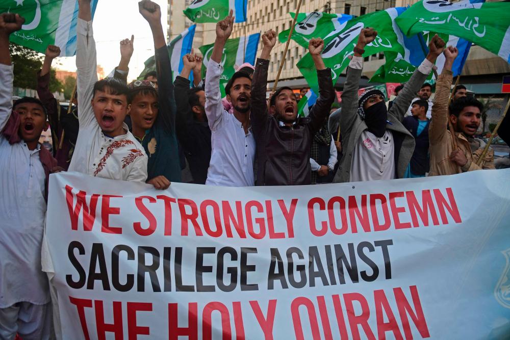 Activists of religious Jamaat-e-Islami (JI) party, chant slogans in a protest in Karachi on January 26, 2023, against the torching of the Koran in Sweden over the weekend. AFPPIX