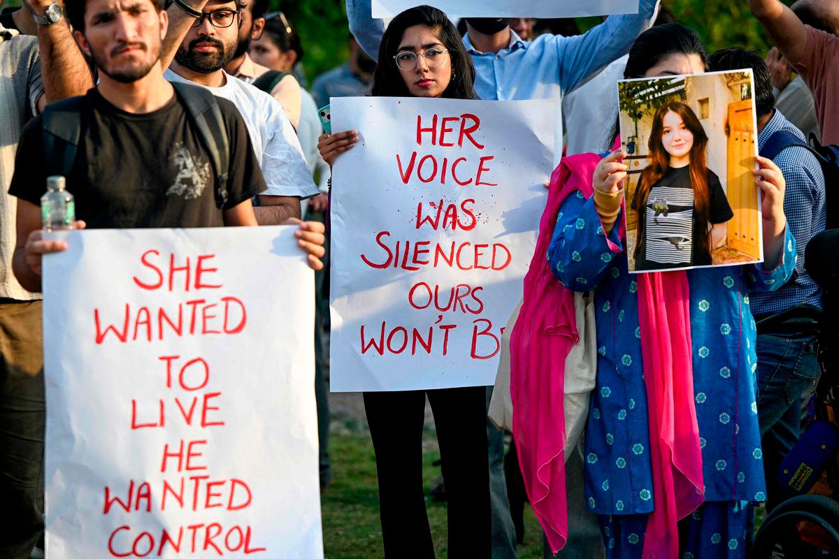 This photograph taken on June 5, 2025 shows demonstrators holding placards and a poster of TikTok star Sana Yousaf during a protest held to condemn violence against women after she was killed for rejecting a man’s proposal in Islamabad. AFPpix