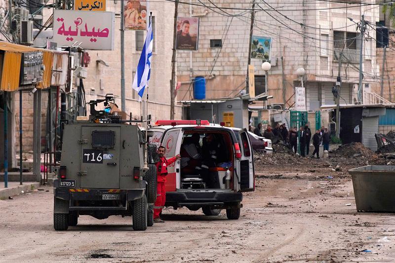 Israeli forces stop a Palestinian ambulance for a search as they block a road during a military raid in Jenin in the occupied West Bank, on January 22, 2025. A Palestinian official reported shooting and explosions in the flashpoint West Bank town of Jenin on January 22, as Israeli forces pressed a raid that the military described as a “counterterrorism” operation. - AFPpix