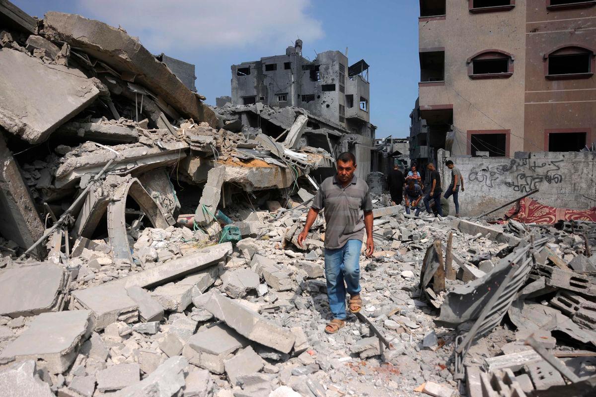 A Palestinian man walk next to the rubble of a residential house that was hit in overnight Israeli strikes in Jabalia in the northern Gaza Strip, on June 30, 2025, as the was between Israel and the Hamas Islamist militant movement continues. (Photo by Bashar TALEB / AFP)