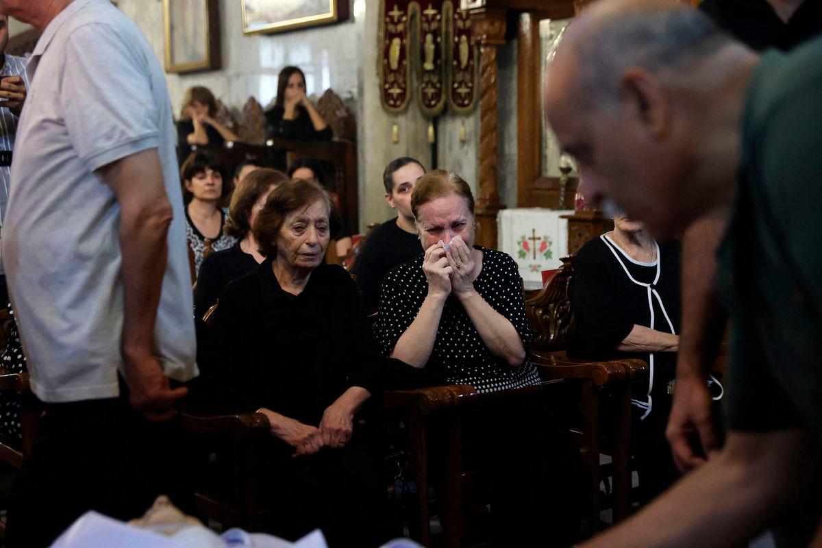 Christian Palestinians mourn Saad Salameh and Foumia Ayyad, killed earlier in an Israeli strike that hit the Holy Family Church in Gaza City - AFPPix