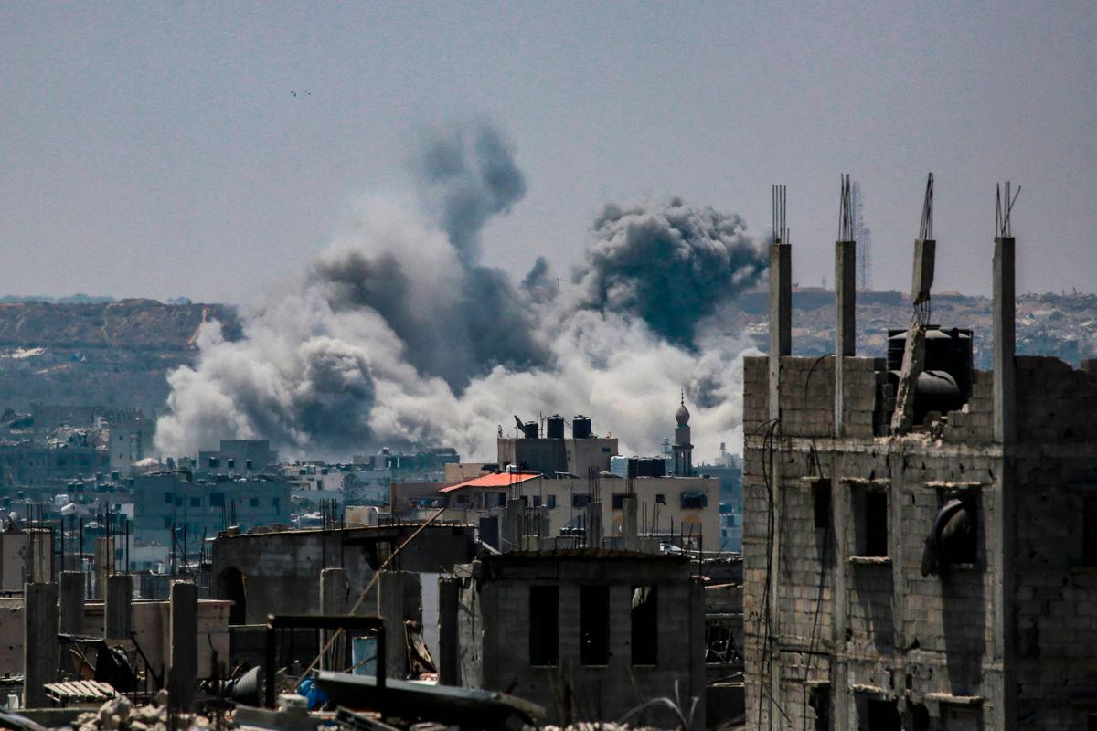 Smoke billowing east of Gaza City, in the central Gaza Strip following Israeli strikes on July 13, 2025. (Photo by Bashar TALEB / AFP)