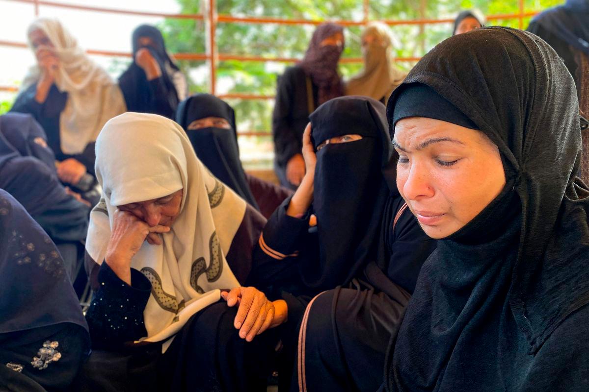 Women react during the funeral for victims killed by Israeli bombardment on the Mawasi area of Khan Yunis, at Nasser Medical Complex in Khan Yunis in the southern Gaza Strip on July 28, 2025. (Photo by AFP)