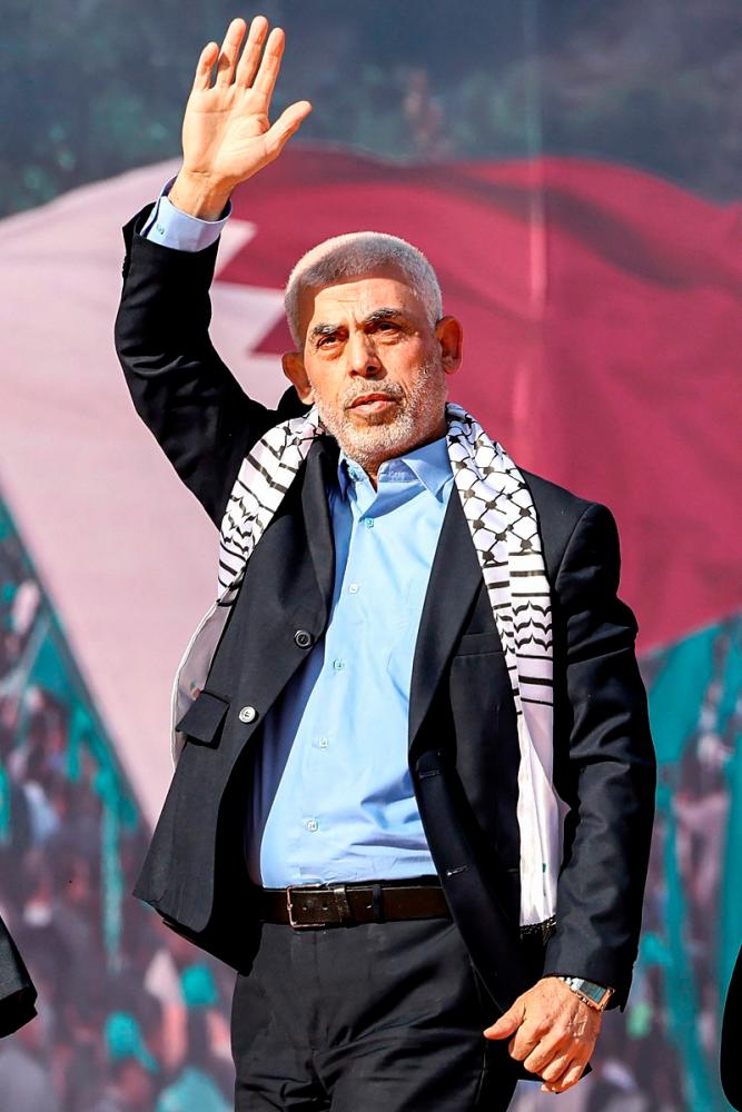 The head of the political wing of the Palestinian Hamas movement in the Gaza Strip Yahya Sinwar attends a rally in support of Jerusalem’s al-Aqsa mosque in Gaza City on October 1, 2022. Israel’s foreign minister has called to “swiftly eliminate” Yahya Sinwar, who was appointed by Hamas on August 6 as the group’s new political leader replacing Ismail Haniyeh who was killed in Tehran last week. - (Photo by MAHMUD HAMS / AFP)