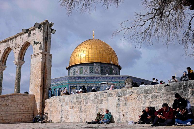 Muslim worshippers prepare to offer Friday Noon prayers at the Dome of the Rock shrine in Jerusalem - AFPpix